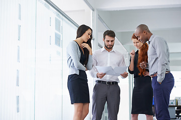 Image showing Team work, businesspeople and discussing paperwork or budget and meeting in office. Project, planning and business gathering for brainstorm with colleagues or company financial or management