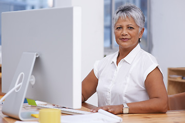 Image showing Computer, portrait and mature woman in office for online management, digital planning and working with career mindset. Confident indian person, professional worker or business employee on desktop pc