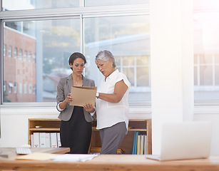 Image showing Paperwork, discussion and business women in office for planning, brainstorming or advice. Corporate team or manager and employee together for collaboration, talking or teamwork on a report or project