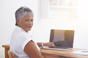 Image showing Computer, portrait and senior woman in office smile for online management, digital project and planning or typing. Face of business person, professional worker or employee working at desk on laptop