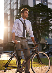 Image showing Bicycle, walking and business man in city for commute, carbon neutral and transportation. Sustainable, professional and travel with male employee with bike in urban town for journey, morning and trip