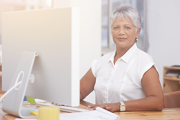 Image showing Desktop, portrait and mature woman in office for online management, digital planning and working with career mindset. Confident indian person, professional worker or business employee on computer pc