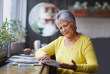 Image showing Cafe, newspaper and senior woman reading daily news, article story or morning paper in store. Coffee shop customer, headline information and relax elderly person, female client or lady in restaurant