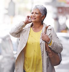 Image showing Phone call, communication and senior woman walk, travel or on urban city commute while talking to cellphone contact. Discussion, conversation and elderly person consulting, speaking or chat on mobile