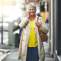 Image showing Phone call, city and portrait of senior woman on cellphone discussion, communication or chat to smartphone user. Urban travel, connectivity and elderly person talking, walking commute or consulting