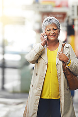 Image showing Phone call, portrait and senior woman walking, travel or on urban city commute while talking on cellphone. Happy, conversation and elderly person consulting, networking or talk on mobile smartphone