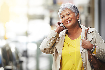 Image showing Phone call, smile and elderly happy woman on urban commute, travel and talking to smartphone contact. City mock up, happiness and senior person consulting, speaking and walking on street sidewalk