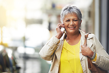 Image showing Phone call, portrait and elderly happy woman on urban road, commute and talking to retirement contact. City travel, discussion and senior person consulting, speaking and walking on street sidewalk