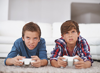 Image showing Boys playing video game, friends and confused while gaming in challenge, competition and concentration. Gamer kids, doubt or console games at home, youth and male children with esports or controller