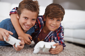 Image showing Boys playing video game, friends in portrait and gaming with technology, esports and entertainment in living room. Gamer kids play games on console at home, youth and male children have fun together