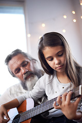 Image showing Girl with grandfather, guitar and learning to play, music education and help with creative development. Musician, art and old man helping female kid learn focus and skill on musical instrument