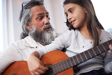 Image showing Grandfather teaching girl to play guitar, learning and development in music with help in creativity. Musician, art and senior man helping female kid learn focus and skill on musical instrument