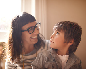 Image showing Love, mother and son bonding, happiness and conversation at home, funny and laughing. Family, female parent and happy mama with a male child, boy and kid with joy, loving and relax in a living room