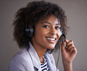 Image showing Portrait, call center and consultant woman in headset for virtual communication, technical support or talking online. Professional agent or face of happy, African business person in telemarketing job