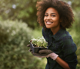 Image showing Black woman in garden, plant and smile in portrait, botany mockup and environment with young gardener and flowers. Happy female person is outdoor with green fingers, growth and plants with gardening