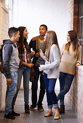 Image showing University, conversation and people on campus talking for chatting, friendship and learning together. Education, scholarship and happy men and women students in school, academy and college hallway