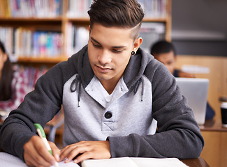 Image showing Learning, writing and college with man in library for education, research and classroom quiz. Focus, study and notebook with male student on university campus for knowledge, scholarship and project