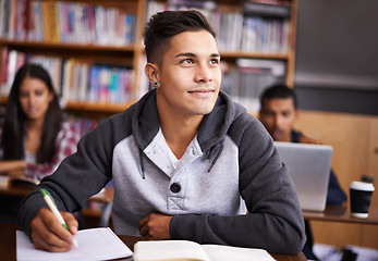 Image showing Thinking, writing and college with man in library for education, research and classroom quiz. Focus, learning and notebook with male student on university campus for study, scholarship or idea