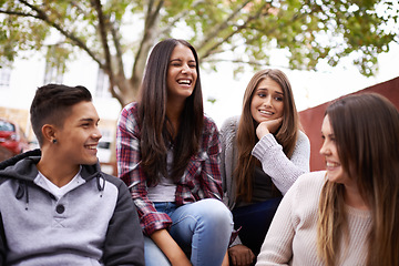 Image showing University, friends and people laugh on campus in conversation, talking and chatting outdoors. Diversity, learning and happy men and comic women students for education on school, academy and college