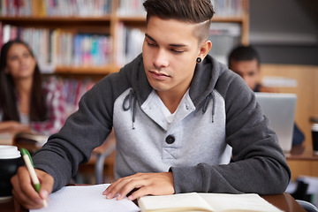 Image showing Study, writing and college with man in classroom for education, library research and quiz. Focus, learning and notebook with male student on university campus for knowledge, scholarship and project