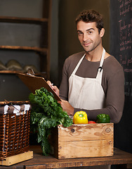 Image showing Chef, clipboard and portrait of man in restaurant with vegetables for vegetarian or vegan ingredients. Happy, male cook with checklist and food from Norway for cooking in kitchen or small business.