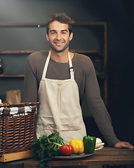 Image showing Chef, smile and portrait of man in kitchen with vegetables for vegetarian meal, healthy diet or vegan nutrition. Cooking, happiness and confident male cook from Canada in restaurant or small business