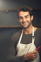 Image showing Chef, hot pepper and portrait of man in kitchen with vegetables for vegetarian, healthy diet or vegan ingredients. Smile, male cook holding chilli and food for spices from Norway for cooking in home