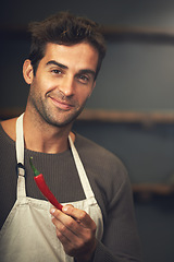 Image showing Chef, chilli and portrait of man in kitchen with vegetables for vegetarian, healthy diet or vegan ingredients. Cooking, male cook holding hot pepper and food for spices from Canada in home or house.