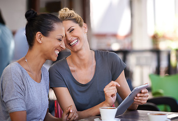 Image showing Conversation, tablet and friends drinking coffee at a cafe together while browsing on social media. Happy, smile and women speaking, laughing and scrolling on a mobile at a restaurant in the city.