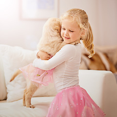 Image showing Child, golden retriever or dog in a house to hug for love, care and development. Face of a cute girl kid and animal puppy or pet in a tutu playing together as friends on the lounge sofa for happiness