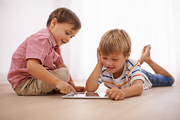 Image showing Learning, tablet and happy children playing together in family home for fun and education. Boy kids or friends on floor to play or streaming internet for development with mobile app, game and video