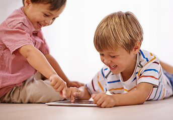 Image showing Children, playing and tablet for learning and education in family home for happiness and fun. Male kids or friends together for play, laughing and streaming on internet for development with app video