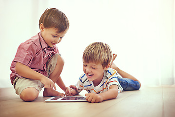 Image showing Children, tablet and learning together in family home for fun and education. Male kids or friends laugh on floor while streaming internet for development with mobile app, online game or funny video