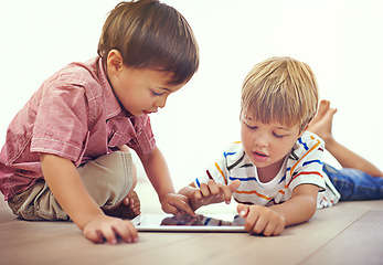 Image showing Tablet, learning and children playing together in family home for fun and education. Male kids or friends on floor to play and streaming internet for development with app, game and online video