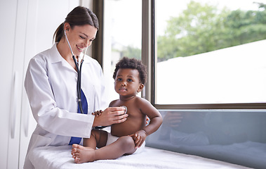 Image showing Doctor woman with baby boy in pediatrician consultation, stethoscope to check heart and lung health. Pediatric cardiology, childhood development with medical checkup at clinic or hospital