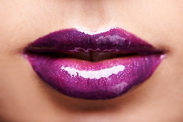 Image showing Woman lips, purple lipstick and shine with makeup and beauty closeup, glossy cosmetics product and cosmetology. Glow, bold color aesthetic and cosmetic care, female model with violet lip gloss