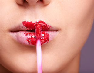 Image showing Closeup of woman lips, red lipstick and brush, makeup and beauty isolated on studio background. Vibrant aesthetic, creativity and mouth of female model with cosmetic product, cosmetology and lipgloss