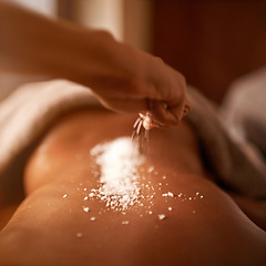 Image showing Spa, back and hands with salt massage of a woman with beauty specialist with treatment. Exfoliate, female person skincare and relax detox application for skin and calm wellbeing at a hotel with care