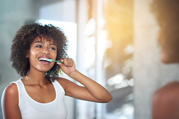 Image showing Mirror, dental and black woman brushing teeth, fresh breath and oral health in the bathroom. Female person, happy model and lady with wellness, mirror and hygiene with morning routine and tooth care