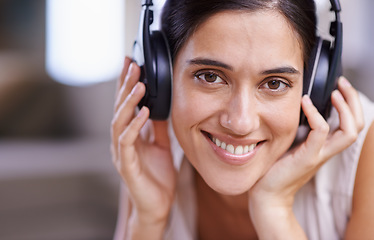 Image showing Happy woman, portrait and headphones listening to music with smile for free time, comfort or relaxing at home. Closeup of female face smiling in living room with headset for audio sound track indoors