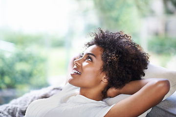 Image showing Relax, thinking and happy woman on sofa in lounge, afternoon nap and rest in calm apartment on weekend. Daydream ideas, peace and girl on couch relaxing, self care and stress free chill time in home.