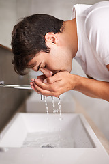 Image showing Water, cleaning face and man washing in bathroom for wellness, facial care and grooming at home. Skincare, beauty and male person for hygiene, hydration and cleansing for wellbeing, health and skin