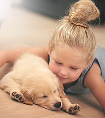 Image showing Girl child hug her puppy, relax at home and happy with sleeping golden retriever dog, friends and peace. Pet care, love and young, calm female kid with her domestic animal lying on wood floor