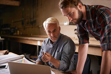 Image showing Architects, teamwork and father and son with laptop in workshop for building construction. Senior engineer, men and computer with trainee or apprentice working on design and planning with mentor.