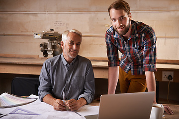 Image showing Carpentry, teamwork and portrait of men in workshop for collaboration with laptop. Senior architect, smile and father and son working on construction project with trainee, apprentice and mentor.