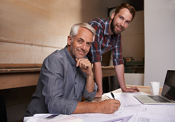 Image showing Architecture, teamwork and portrait of men in workshop for collaboration on carpentry design. Senior architect, smile and father and son working on blueprint with trainee, apprentice and mentor.