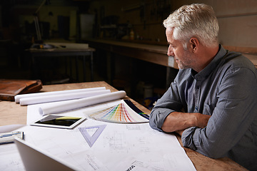 Image showing Man, senior architect and blueprint drawing in workshop, professional designer and engineering. Architecture design, floor plan paperwork on table with designing equipment and creative male engineer