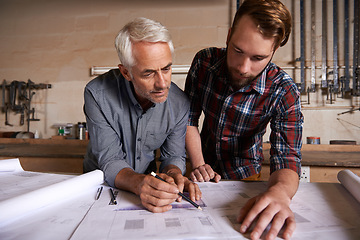 Image showing Architect team, working on blueprint in workshop and designer for engineering collaboration. Senior in architecture with male trainee, work on remodeling project with floor plan paperwork and drawing