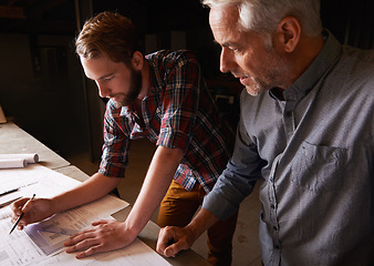 Image showing Architecture team, blueprint design in workshop and designer for engineering collaboration. Male architect in meeting, planning and working on remodeling project with floor plan paperwork and drawing