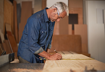 Image showing Carpenter in workshop, measurement and man with pencil, measuring tape and designer furniture manufacturing. Creativity, small business and carpentry, professional planning sustainable wood project.